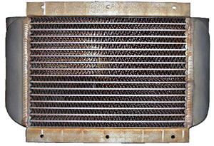 A metal radiator with horizontal fins and a rectangular shape. The edges are slightly rusted, and it has a vintage appearance.