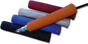 Five cylindrical cable sleeves in red, beige, blue, black, and orange are stacked. The orange sleeve has a visible cable connector protruding from one end.