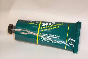 Green tube of chemical-resistant valve lubricant, labeled "3452," with a black cap. Contains 57 grams (2 oz). Text highlights resistance to chemicals and temperature range of -70°F to 500°F.