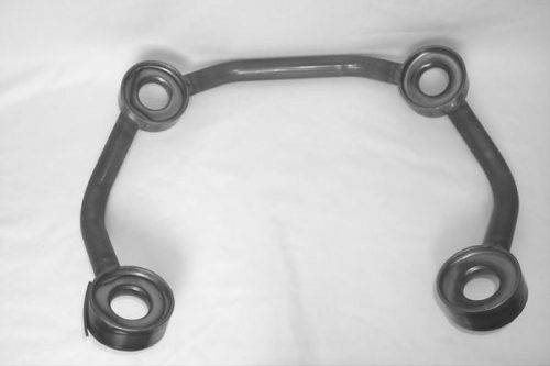 A black, angular metal frame with four circular openings, arranged symmetrically on a white background.
