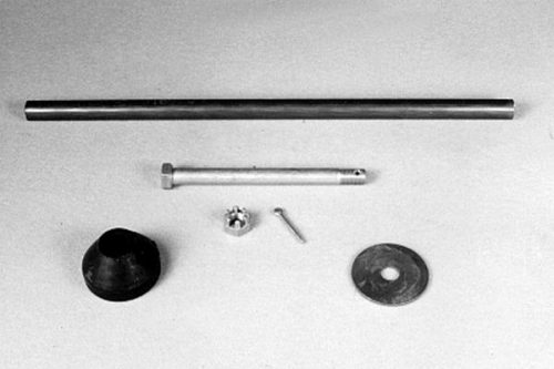 A set of hardware components on a plain surface, including a long metal rod, a shorter bolt, a small screw, a rubber stopper, a nut, and a metal washer.
