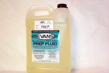 A plastic container labeled "Evans Non-Aqueous Post Drain Prep Fluid" with a brown cap. The label includes product information and instructions. The container is set against a plain white background.