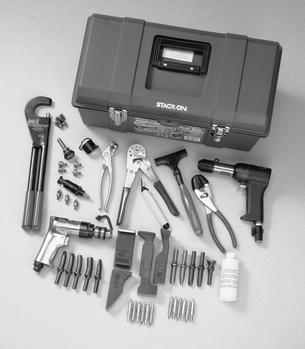 A toolbox with a variety of tools, including pliers, wrenches, a hammer, screwdrivers, drill bits, and a bottle of lubricant, arranged neatly around it.
