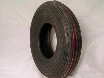A black rubber tire with visible tread patterns and a red stripe around the side, positioned upright against a plain white background.