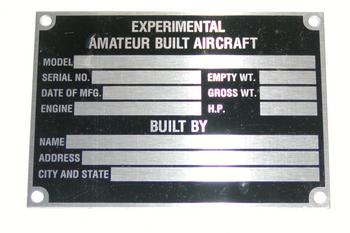 Metal plaque labeled "Experimental Amateur Built Aircraft" with spaces for model, serial number, date of manufacture, engine, empty and gross weight, horsepower, builder's name, address, city, and state.