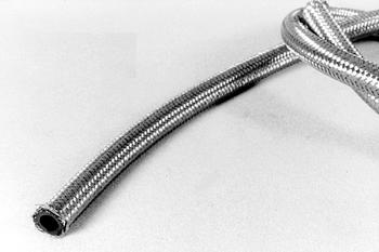 A coiled metal hose with a flexible, corrugated surface lies on a plain background. The hose is partially uncoiled, showing its textured structure.